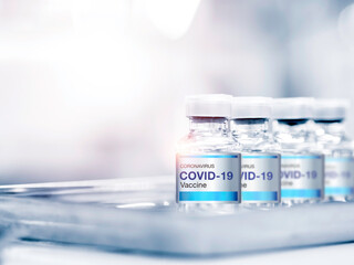Covid-19 Coronavirus vaccine bottle with label.