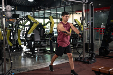 Fototapeta na wymiar Man With Weight Training Equipment On Sport Gym
