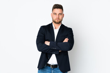 Young Russian business man isolated on white background keeping arms crossed