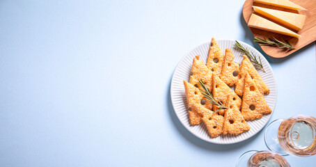 Parmesan savory cookies with rosemary. Salty cheese cookies. Healthy snack. trendy background image. top view, copy space, flat lay