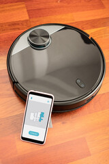 Automatic vacuum cleaner robot to clean the floor and help in housework controlled by an smart...