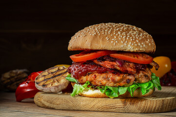 Home made delicious burger on a wooden table.