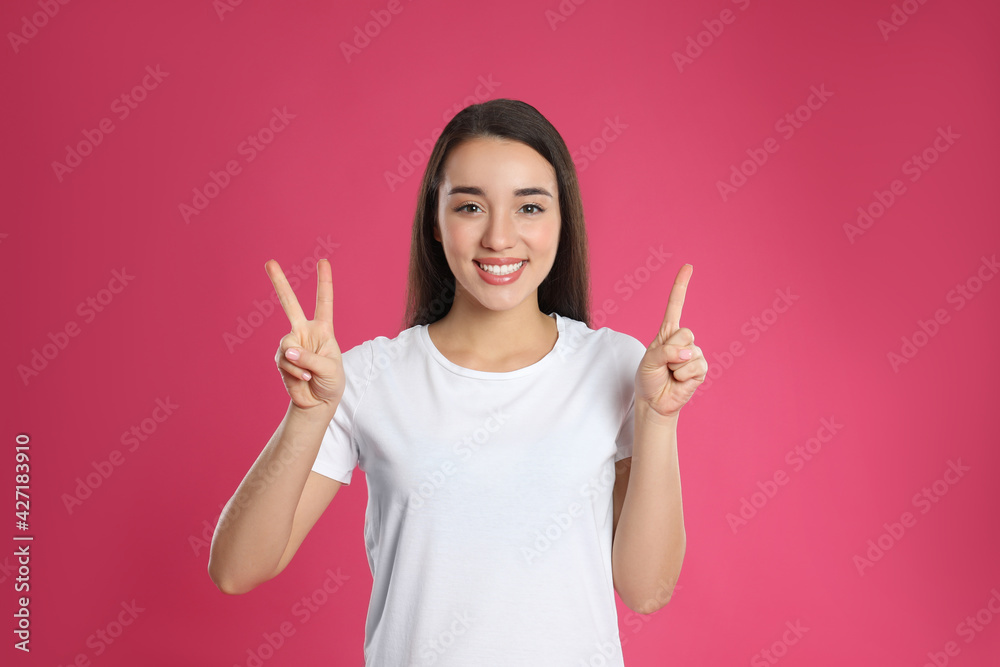 Sticker Woman showing number three with her hands on pink background