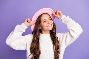 Portrait of brunette long hairdo sweet girl hands cap wear sweater isolated on violet color background