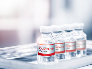 Covid-19 Coronavirus vaccine bottle with label.