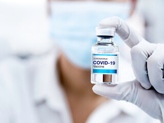 Covid-19 Coronavirus vaccine bottle with label.