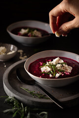 Fresh homemade vegetarian beetroot creamy soup with feta cheese