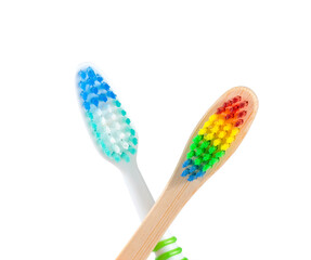  wooden  and plactic toothbrushes on a white background