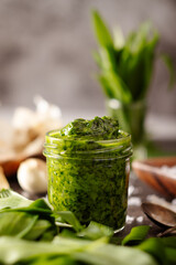 Fresh homemade wild garlic pesto in glass jar