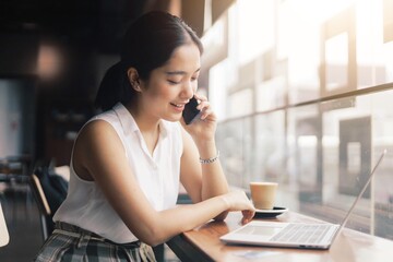woman talking on phone in office