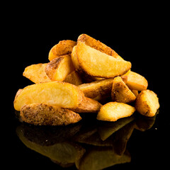Potato wedges on black background