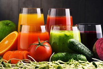 Glasses with fresh organic vegetable and fruit juices