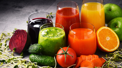 Glasses with fresh organic vegetable and fruit juices