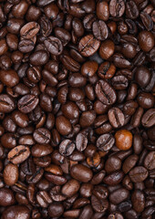 Fresh raw organic coffee beans top view background.