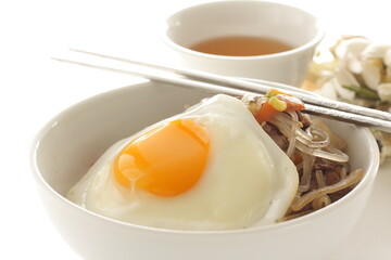 sunny side up fried egg on Korean Japchea green noodles stir fried