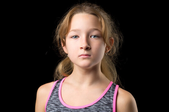 Portrait of cute sporty teenage girl. Photo session in the studio