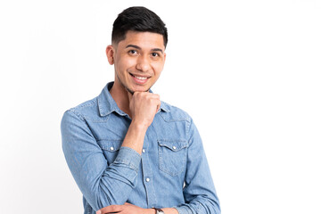 Latin man with hand on chin looking at camera with white background