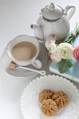 Homemade butter and coffee cookie with milk tea for reading time