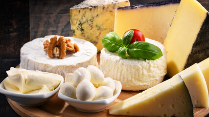 Different sorts of cheese on kitchen table