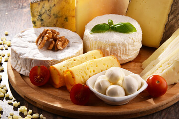 Different sorts of cheese on kitchen table