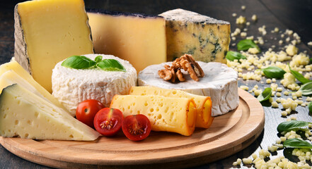 Different sorts of cheese on kitchen table