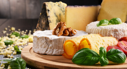Different sorts of cheese on kitchen table