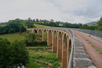 Fototapeta premium Old rail road bridge (Viaduc de juré) in the Loire Department in France