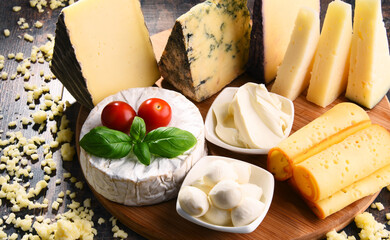 Different sorts of cheese on kitchen table
