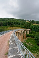 Fototapeta na wymiar Old rail road bridge (Viaduc de juré) in the Loire Department in France