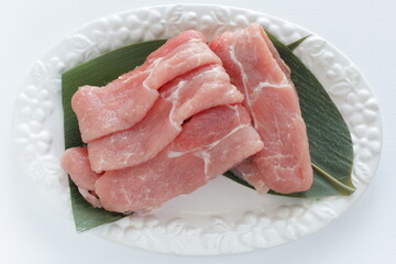 freshness pork slices on leaf for prepared ingredient