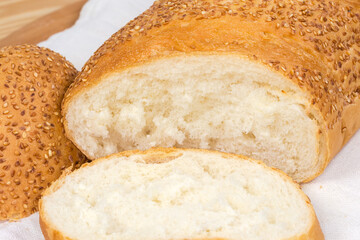 Pieces of wheat bread sprinkled with sesame close-up