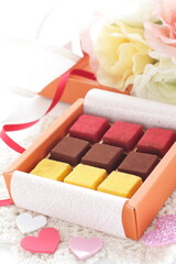 Multiple color and favor chocolate in gift box for holiday image