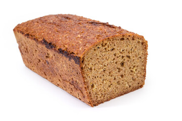 Rectangular loaf of whole wheat bread close-up, selective focus