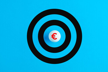 Ball with euro symbol as the bulls eye of a target. Financial goals or currency investment