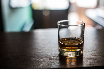 Whisky glass on a wooden surface