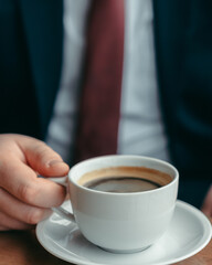 cup of coffee in hands