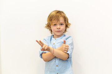 Portrait of a boy looking thumb up.