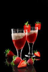 Strawberry and Strawberry Smoothie. Strawberry dessert. Black glossy background. Reflection. Place for your text.