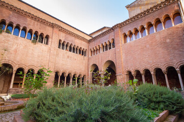 Fototapeta premium The European garden inside the cloister of the Basilica of San Lorenzo,with long corridor built in the 12th century,The environment is relaxing , peaceful and pleasant to live.