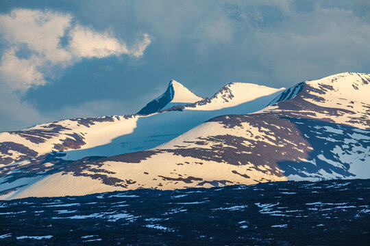 landscape with snow covered mountains in spring in Sarek national park, Sweden. 
