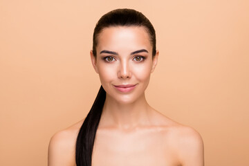 Photo of optimistic brunette hairdo lady without clothes isolated on pastel beige color background