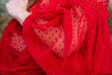 close up of a red dress on sleeve