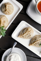 Georgian traditional dumplings Khinkali with meat on white plate. Caucasuan cuisine.