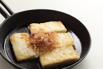 Japanese food, pan fried tofu and Katsuobushi in skillet pan