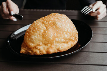 Uzbek eastern Tatar cuisine. Cheburek - fried pie with meat and onions. Homemade Fried Pies.