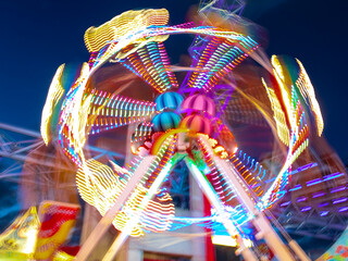 Fototapeta na wymiar light glowing colours of Easter Show with a camera Slow Shutter movement producing beautiful lighting rainbow colouful effects 