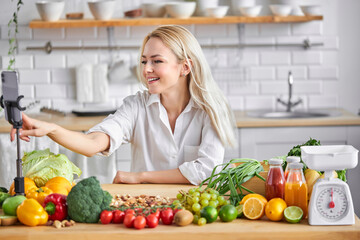 blonde woman recording on mobile phone vlog about healthy eating