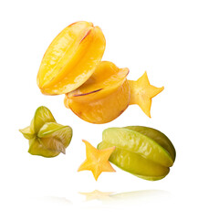 Creative image with fresh yellow carambola falling in the air