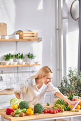 friendly dietologist filming vlog on mobile phone. woman blogger recording video blog where, sharing advice