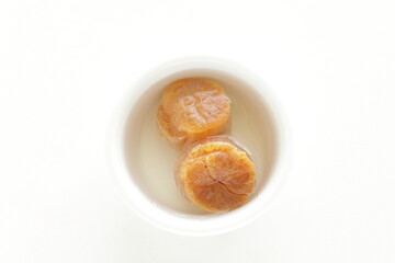 Chinese gourmet food ingredient, dried scallop soaked in water with copy space 